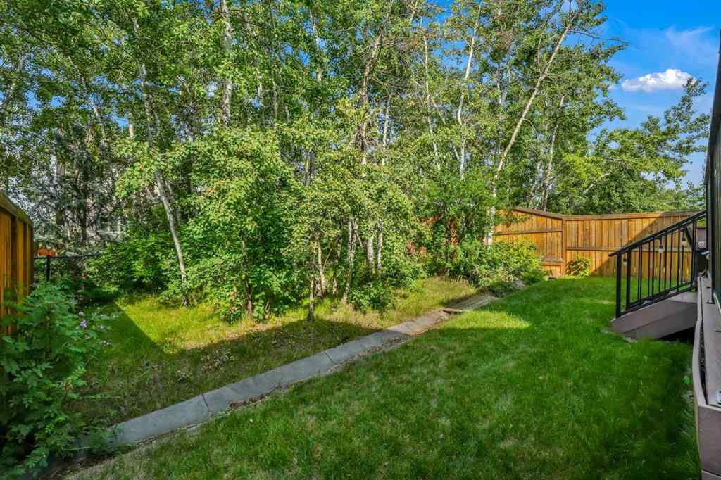 MLS® A2241206 - 105 Tremblant Place SW in Springbank Hill Calgary, Residential