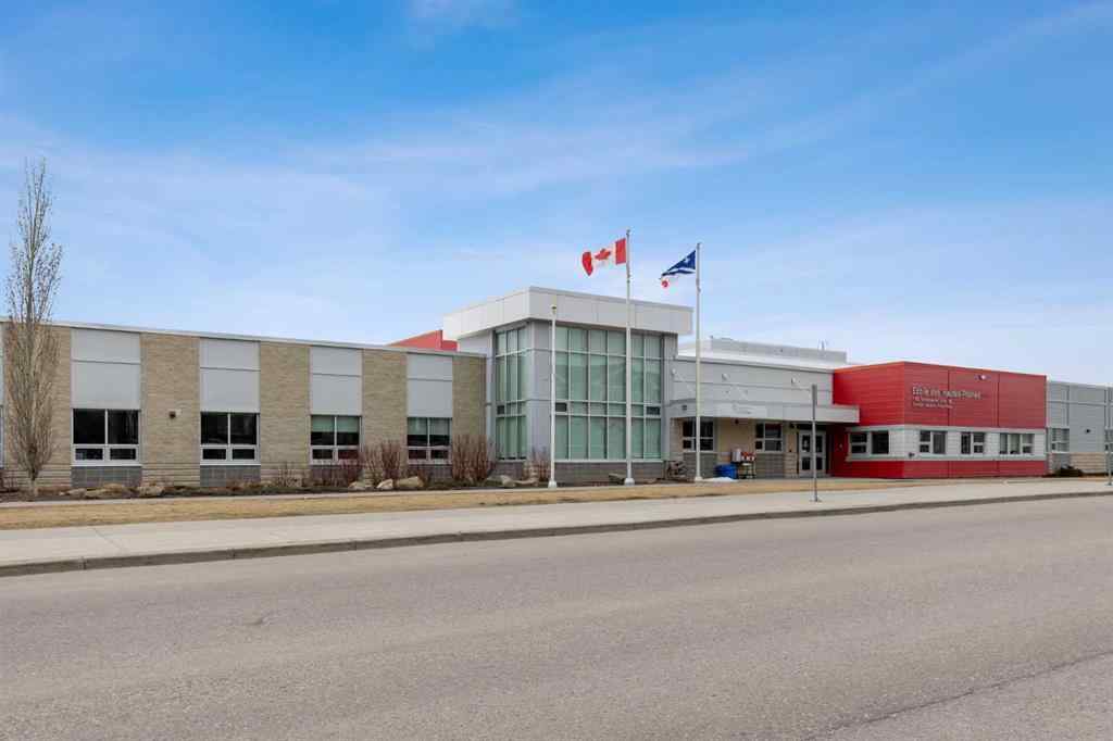 MLS® A2241328 - Unit #113 2802 Kings Heights Gate SE in Ravenswood Airdrie, Residential