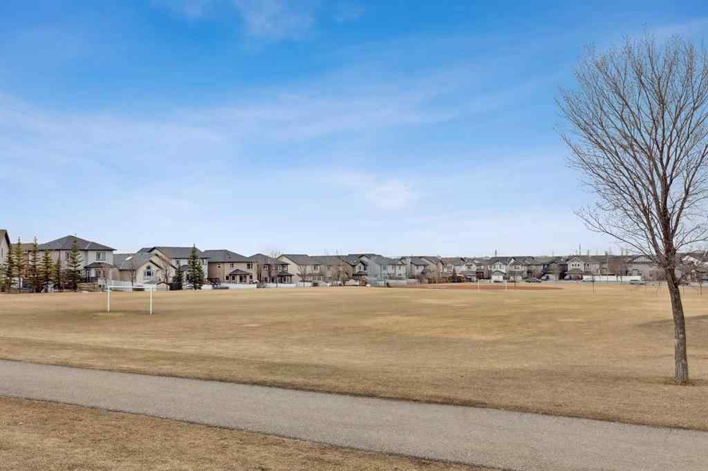 MLS® A2241328 - Unit #113 2802 Kings Heights Gate SE in Ravenswood Airdrie, Residential