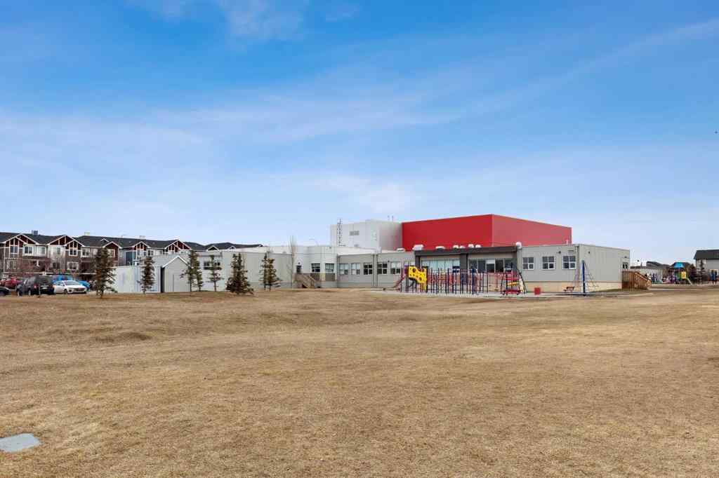 MLS® A2241328 - Unit #113 2802 Kings Heights Gate SE in Ravenswood Airdrie, Residential