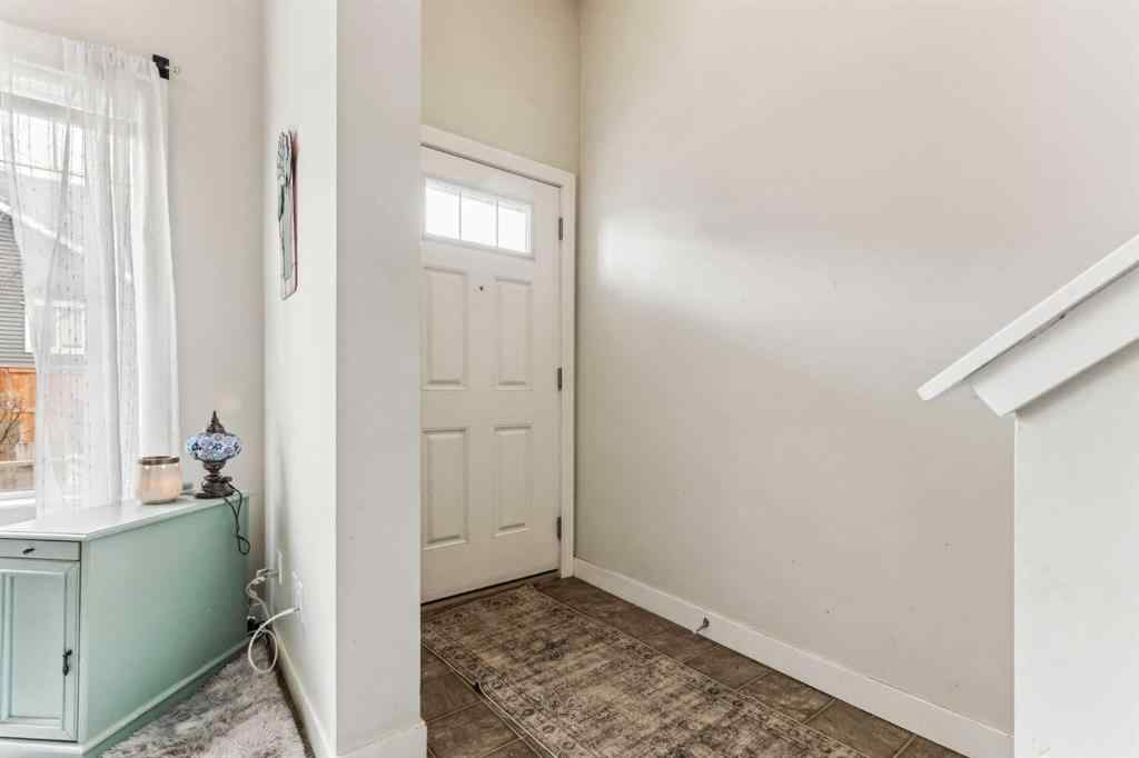 MLS® A2241328 - Unit #113 2802 Kings Heights Gate SE in Ravenswood Airdrie, Residential