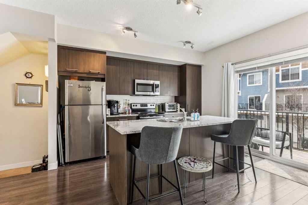 MLS® A2241328 - Unit #113 2802 Kings Heights Gate SE in Ravenswood Airdrie, Residential