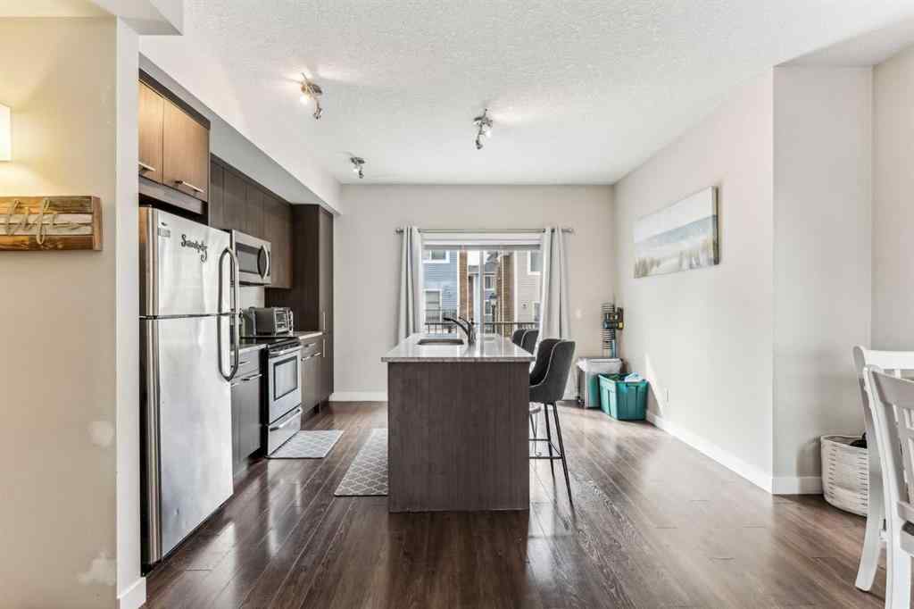 MLS® A2241328 - Unit #113 2802 Kings Heights Gate SE in Ravenswood Airdrie, Residential