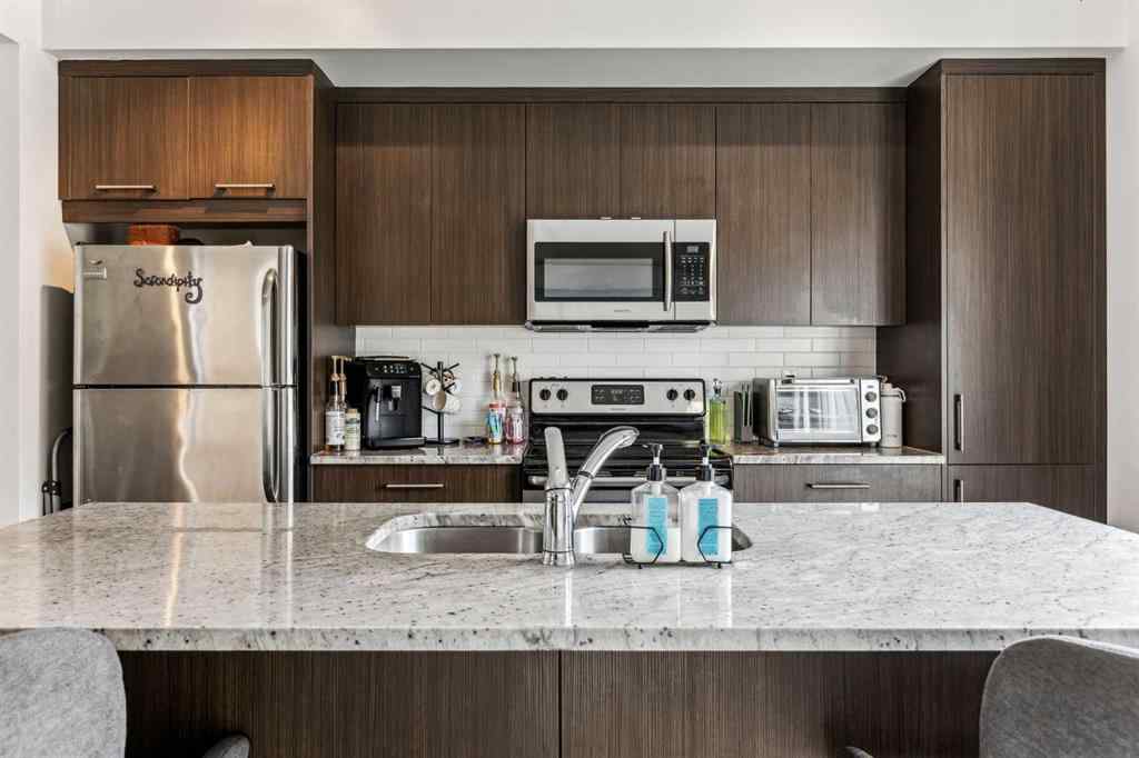 MLS® A2241328 - Unit #113 2802 Kings Heights Gate SE in Ravenswood Airdrie, Residential
