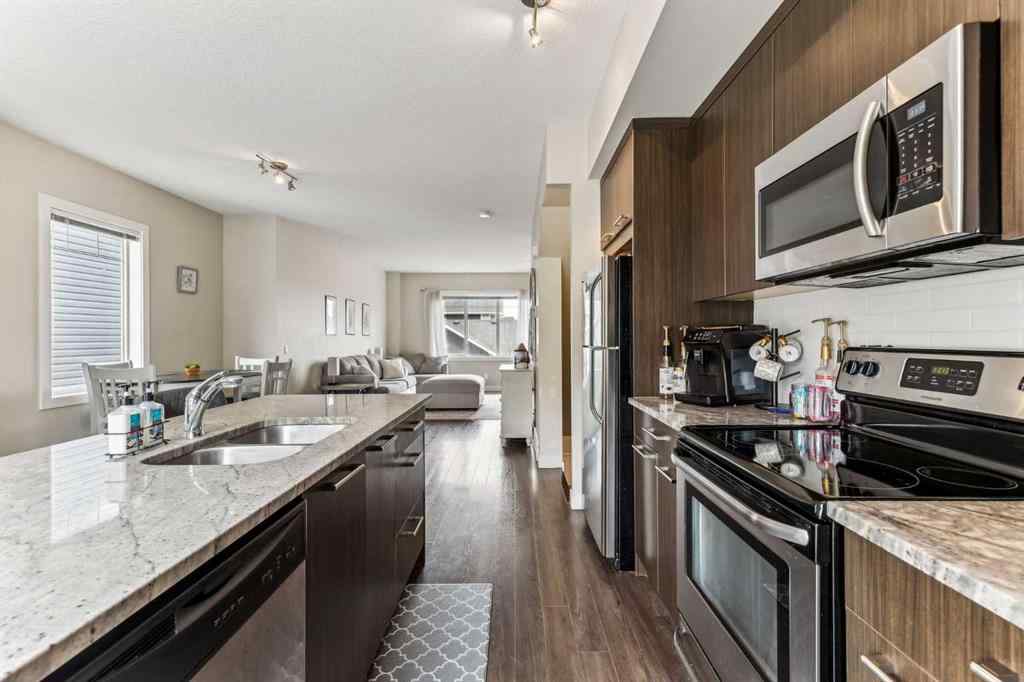 MLS® A2241328 - Unit #113 2802 Kings Heights Gate SE in Ravenswood Airdrie, Residential