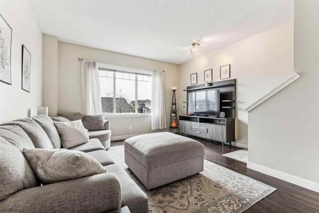 MLS® A2241328 - Unit #113 2802 Kings Heights Gate SE in Ravenswood Airdrie, Residential