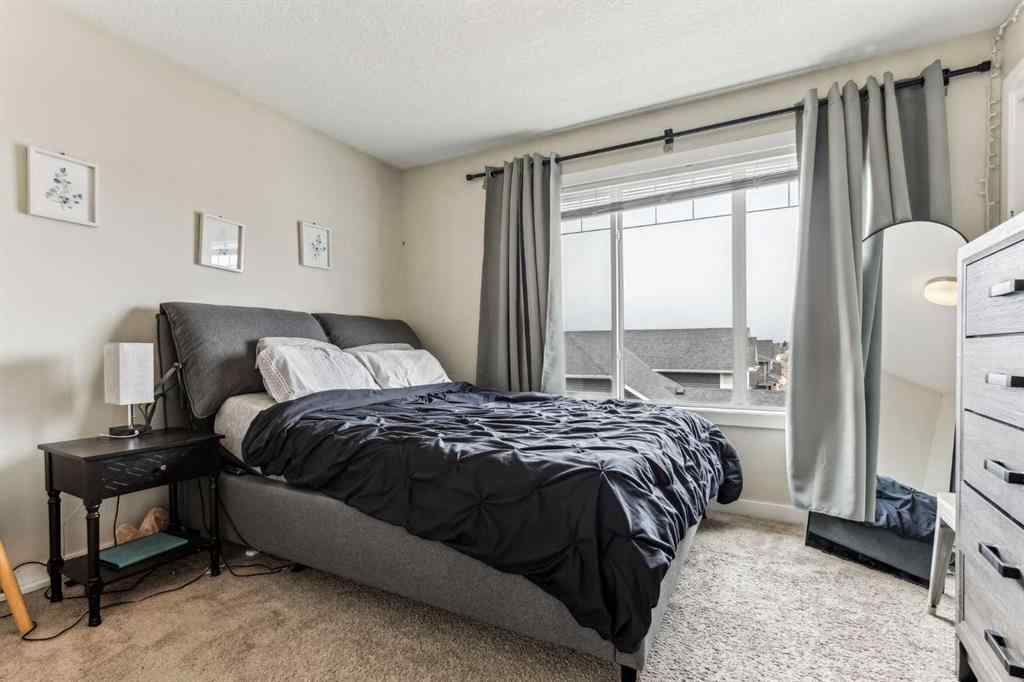 MLS® A2241328 - Unit #113 2802 Kings Heights Gate SE in Ravenswood Airdrie, Residential