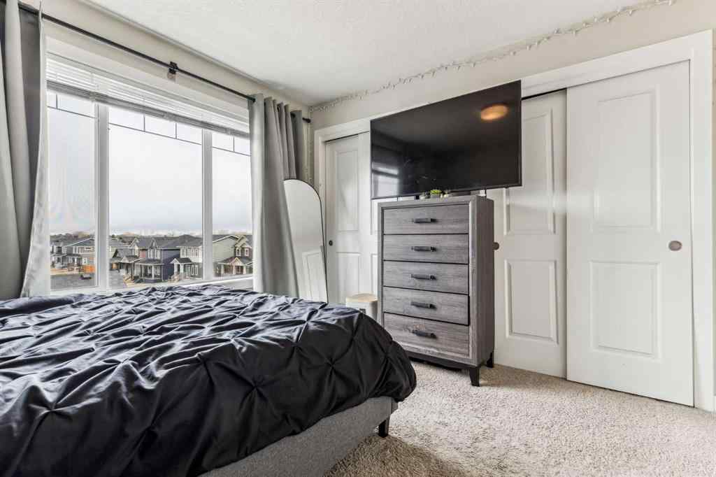 MLS® A2241328 - Unit #113 2802 Kings Heights Gate SE in Ravenswood Airdrie, Residential