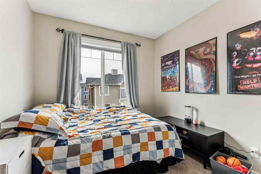 MLS® A2241328 - Unit #113 2802 Kings Heights Gate SE in Ravenswood Airdrie, Residential