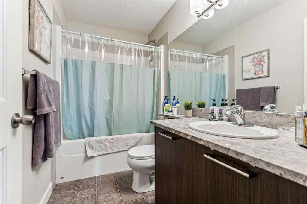 MLS® A2241328 - Unit #113 2802 Kings Heights Gate SE in Ravenswood Airdrie, Residential