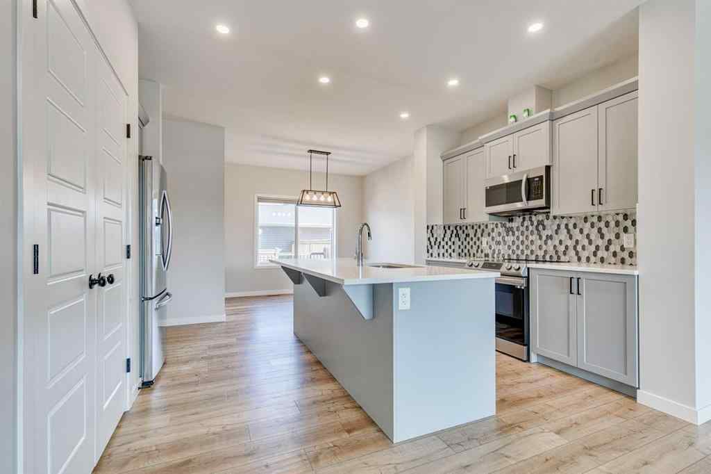 MLS® A2241724 - 452 Reynolds Avenue SW in Coopers Crossing Airdrie, Residential