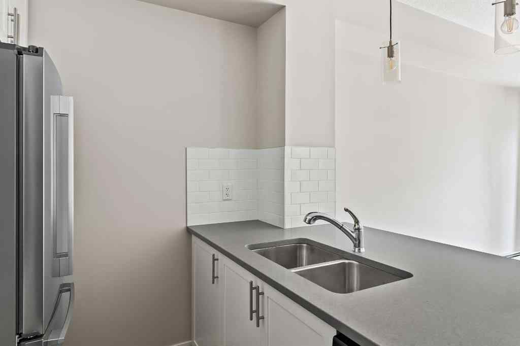 MLS® A2241893 - Unit #206 100 Auburn Meadows Manor SE in Auburn Bay Calgary, Residential