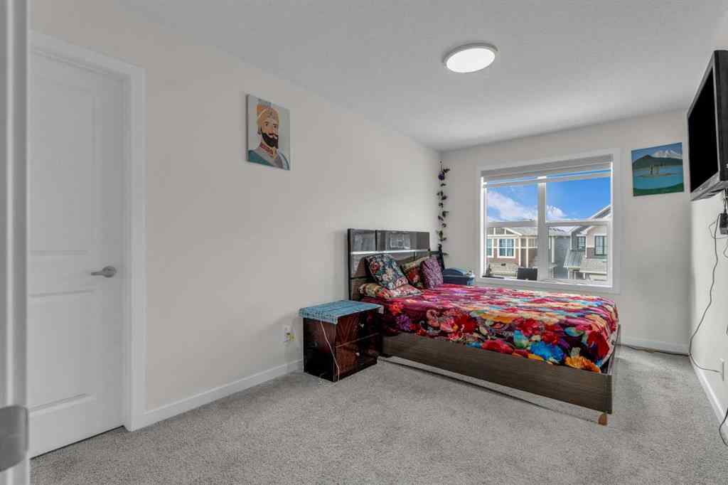 MLS® A2242007 - 203 Lucas Close NW in Livingston Calgary, Residential