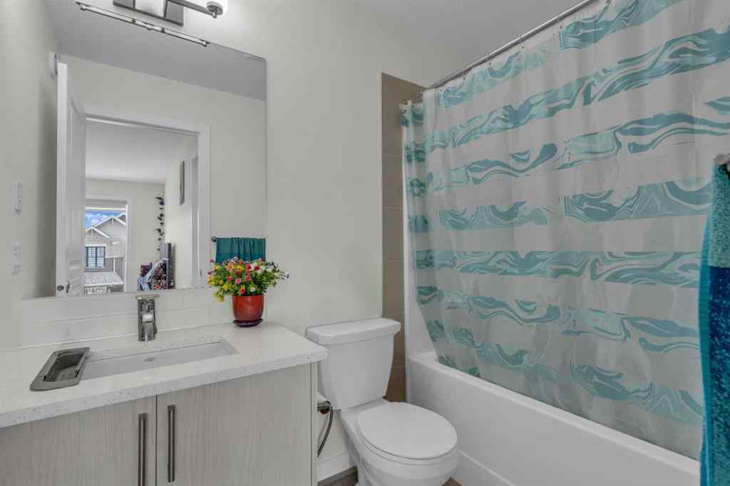 MLS® A2242007 - 203 Lucas Close NW in Livingston Calgary, Residential