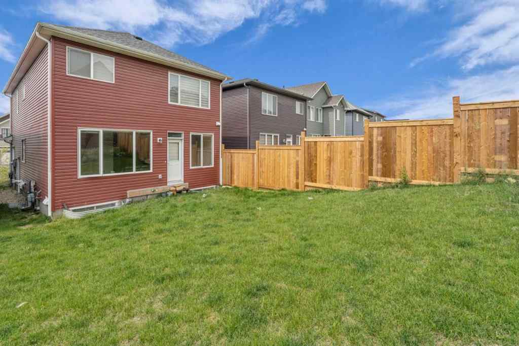 MLS® A2242007 - 203 Lucas Close NW in Livingston Calgary, Residential