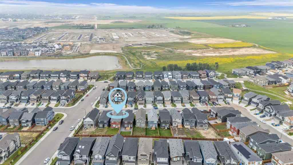 MLS® A2242007 - 203 Lucas Close NW in Livingston Calgary, Residential