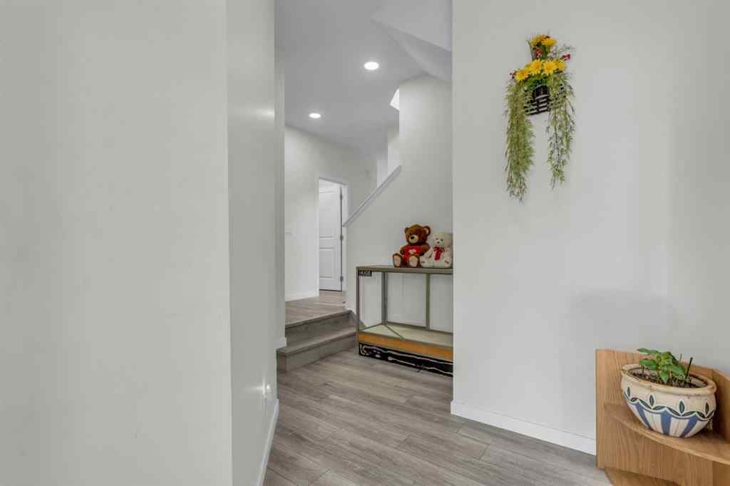 MLS® A2242007 - 203 Lucas Close NW in Livingston Calgary, Residential