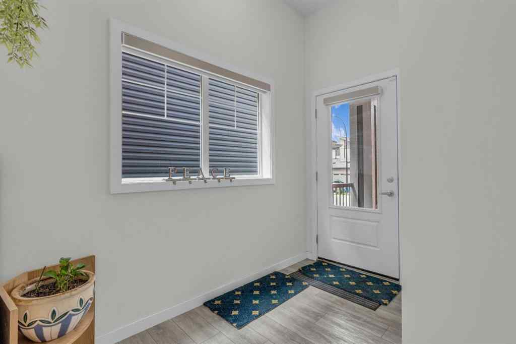 MLS® A2242007 - 203 Lucas Close NW in Livingston Calgary, Residential