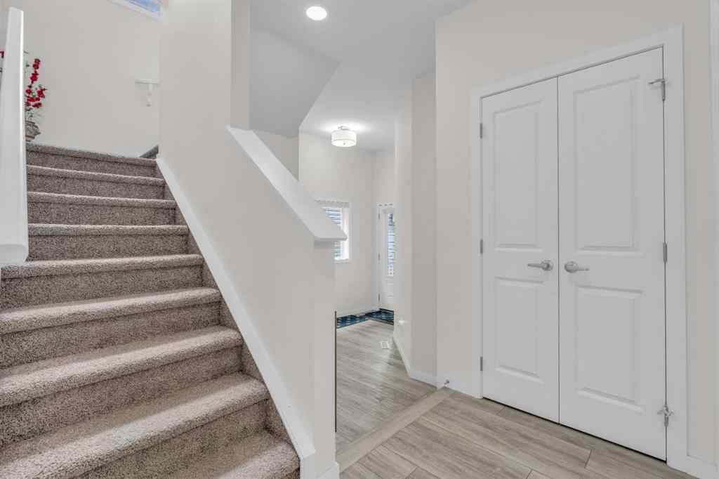MLS® A2242007 - 203 Lucas Close NW in Livingston Calgary, Residential