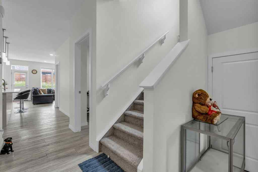 MLS® A2242007 - 203 Lucas Close NW in Livingston Calgary, Residential