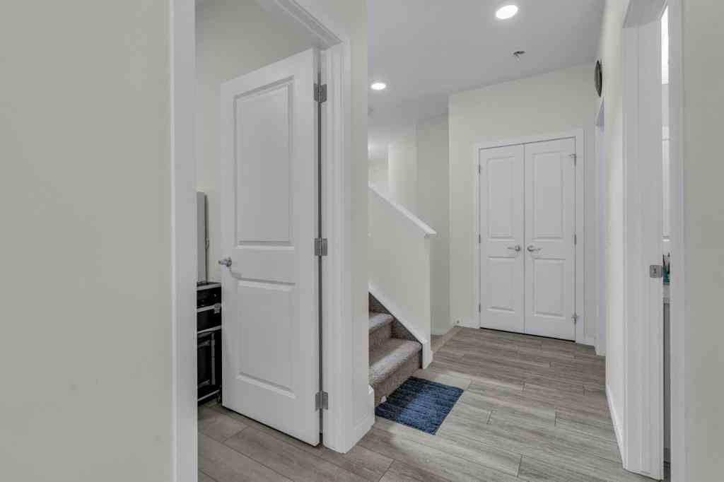 MLS® A2242007 - 203 Lucas Close NW in Livingston Calgary, Residential