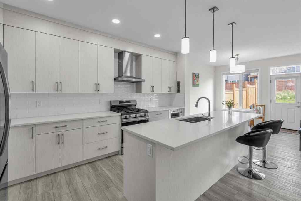 MLS® A2242007 - 203 Lucas Close NW in Livingston Calgary, Residential