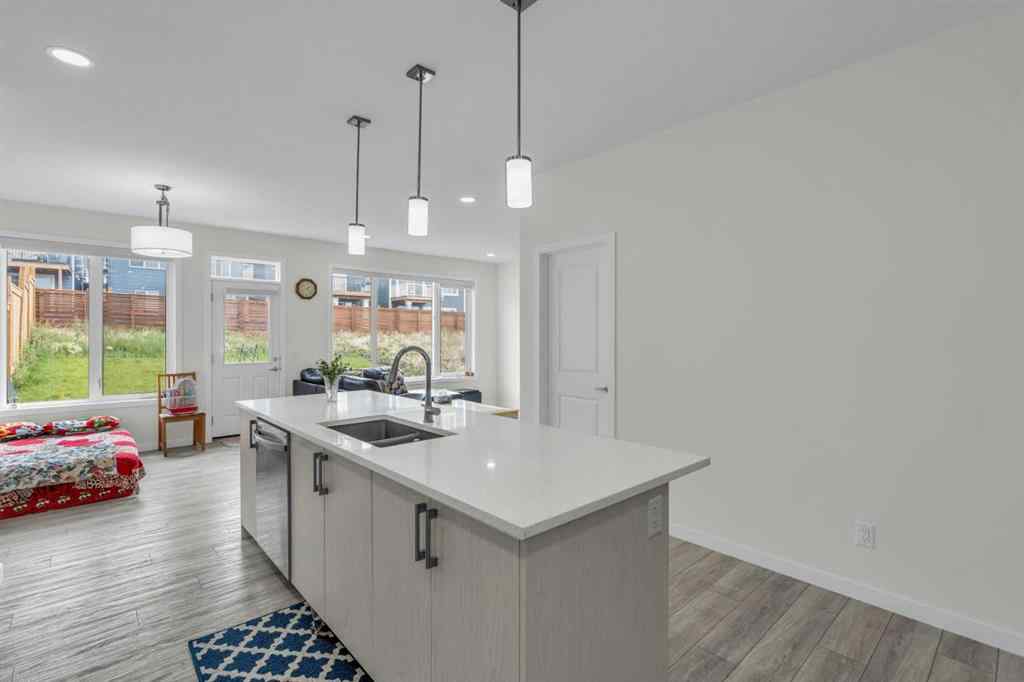 MLS® A2242007 - 203 Lucas Close NW in Livingston Calgary, Residential