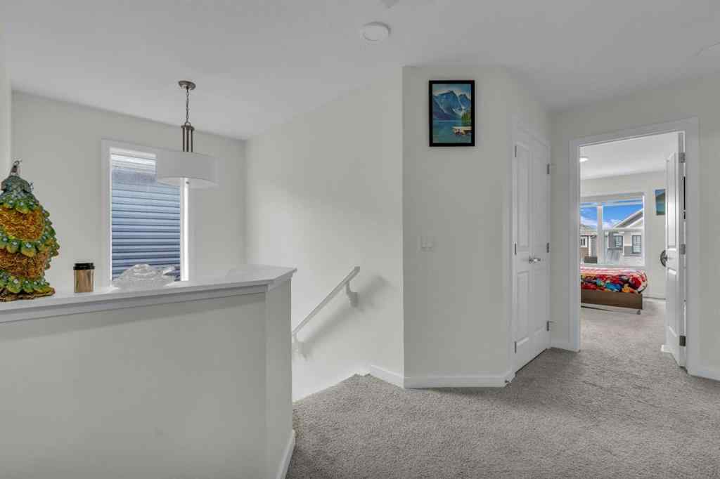 MLS® A2242007 - 203 Lucas Close NW in Livingston Calgary, Residential