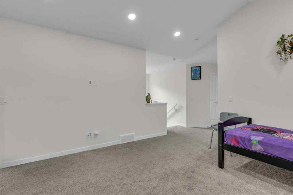 MLS® A2242007 - 203 Lucas Close NW in Livingston Calgary, Residential