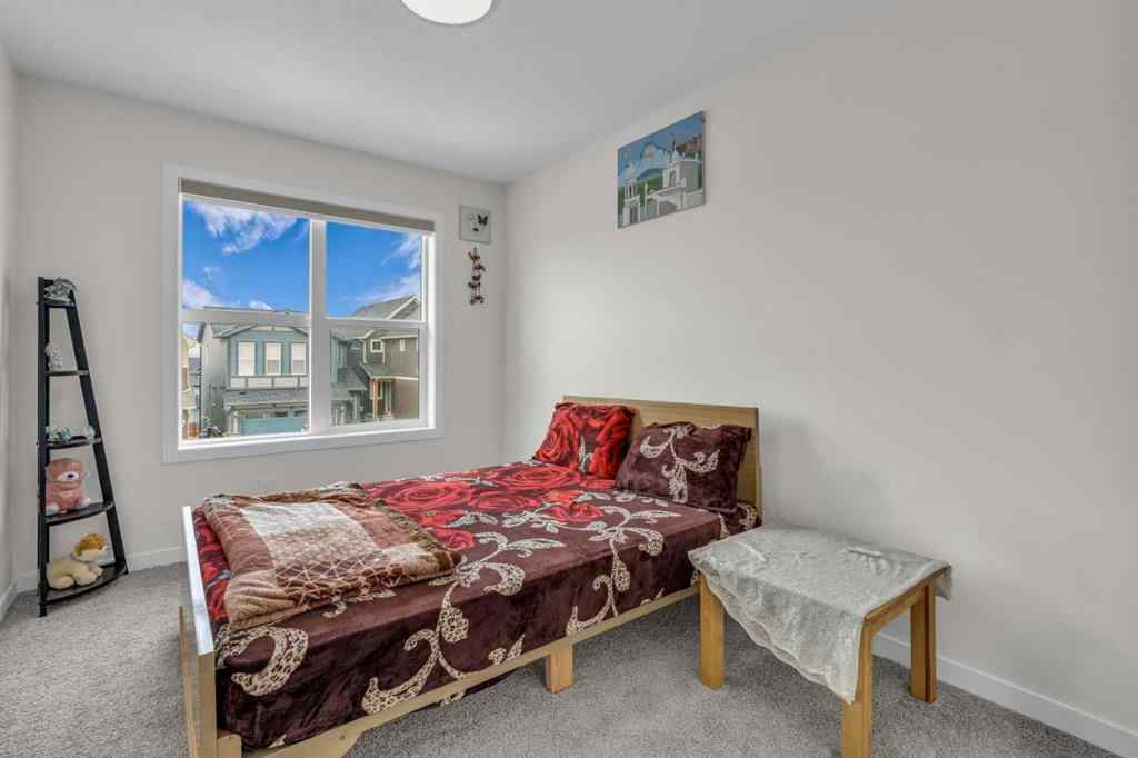 MLS® A2242007 - 203 Lucas Close NW in Livingston Calgary, Residential
