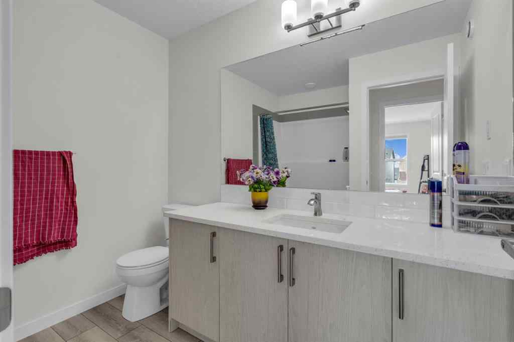 MLS® A2242007 - 203 Lucas Close NW in Livingston Calgary, Residential