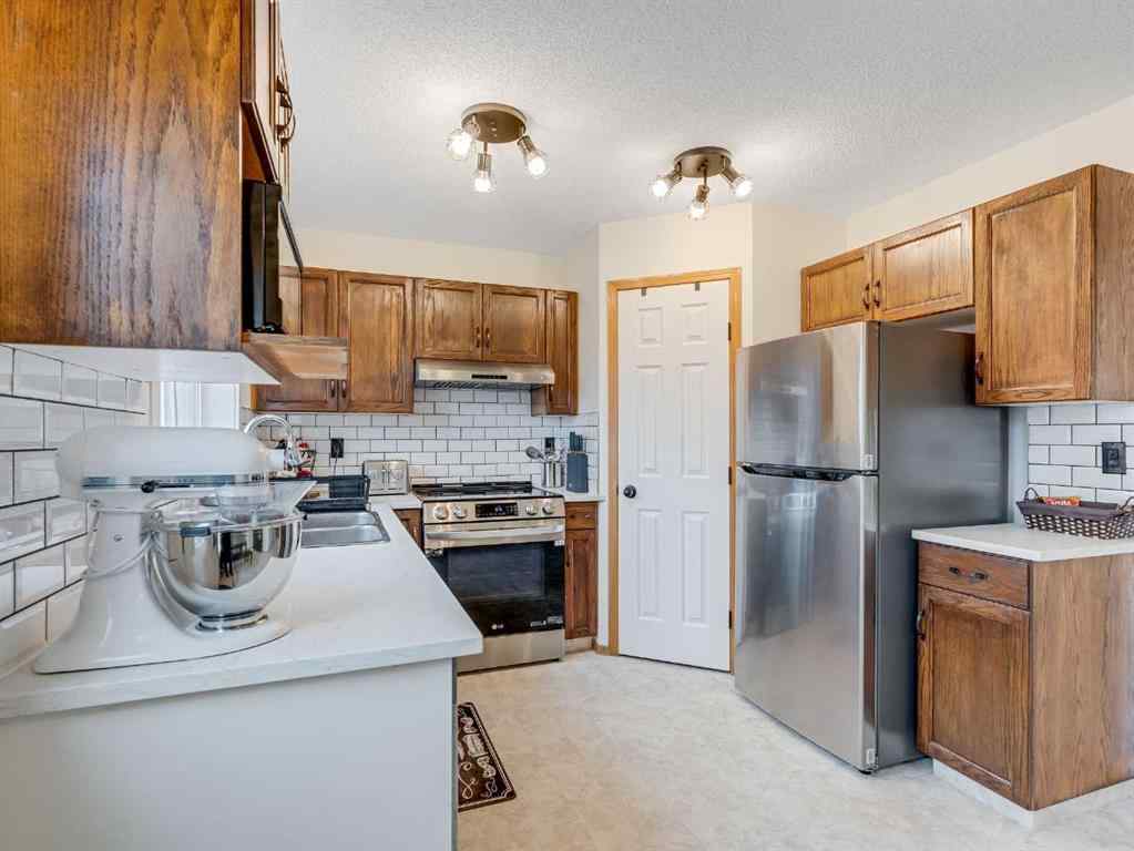 MLS® A2242056 - 68 Bridleridge Gardens SW in Bridlewood Calgary, Residential