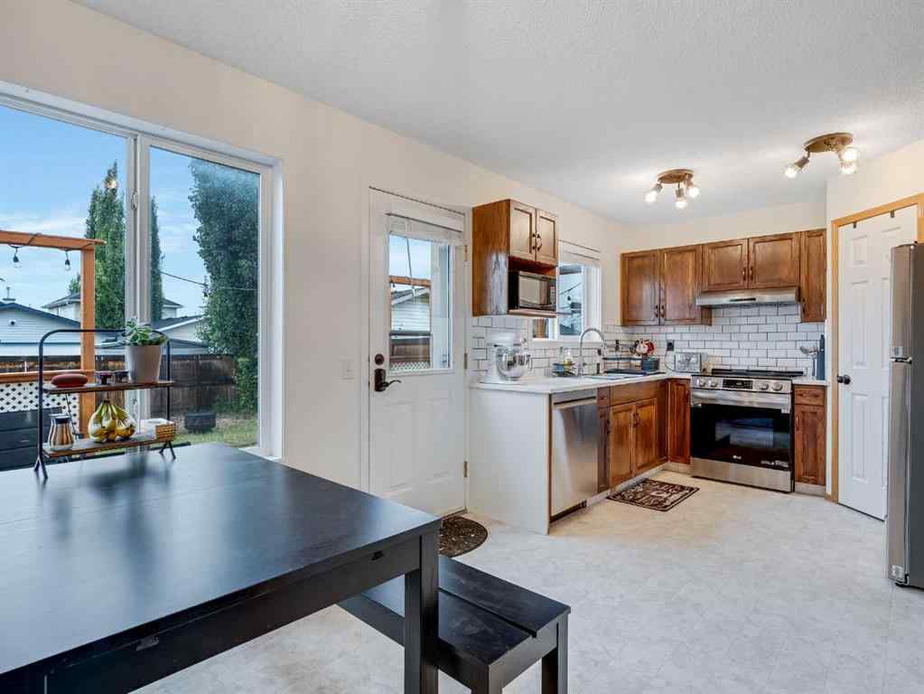 MLS® A2242056 - 68 Bridleridge Gardens SW in Bridlewood Calgary, Residential