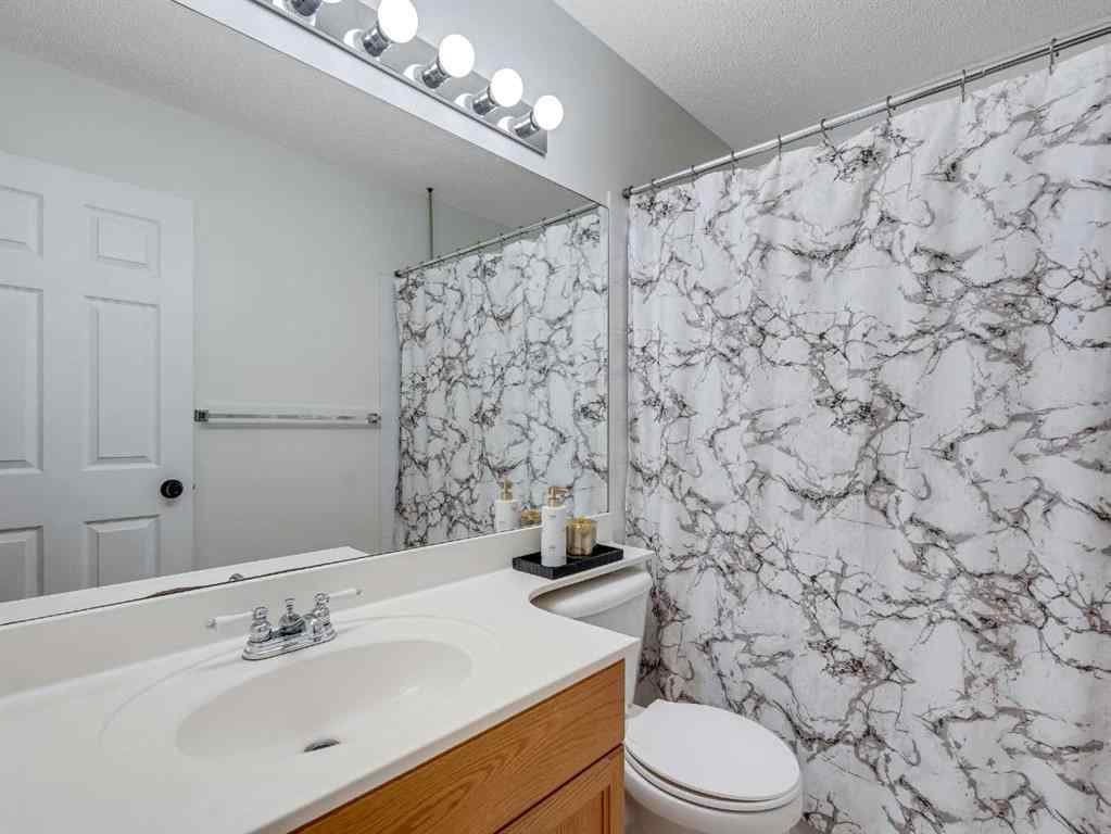 MLS® A2242056 - 68 Bridleridge Gardens SW in Bridlewood Calgary, Residential