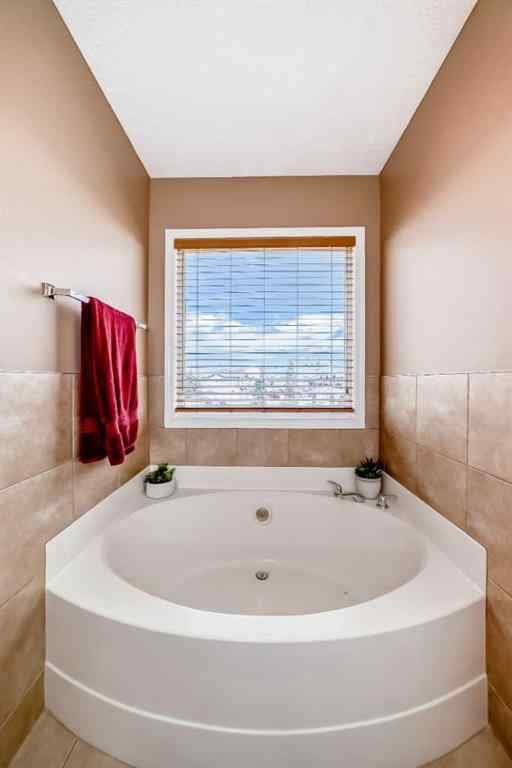 MLS® A2242078 - 148 Saddlecrest Gardens NE in Saddle Ridge Calgary, Residential