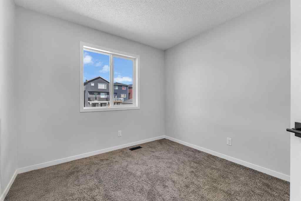 MLS® A2242156 - 218 Edith Road NW in Glacier Ridge Calgary, Residential