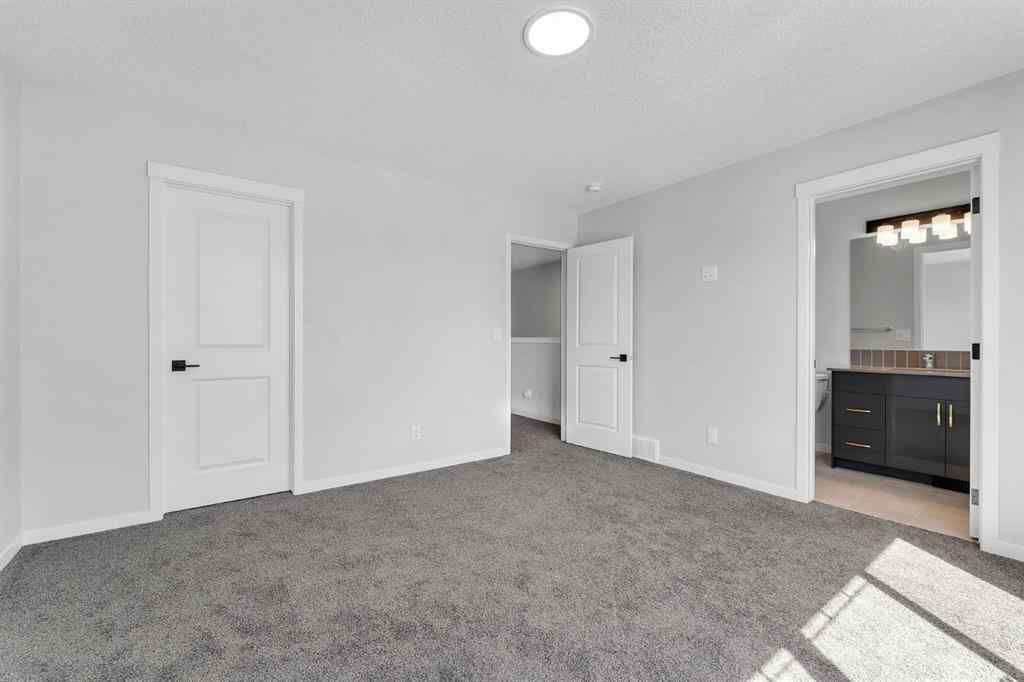 MLS® A2242156 - 218 Edith Road NW in Glacier Ridge Calgary, Residential