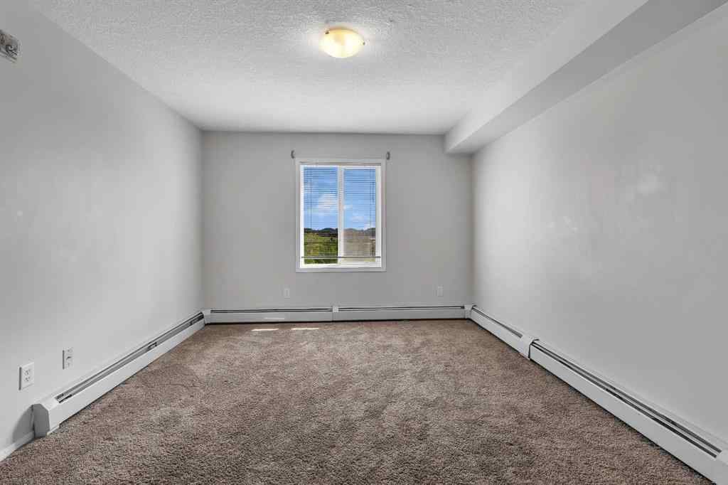 MLS® A2242213 - Unit #6307 304 Mackenzie Way SW in Downtown Airdrie, Residential