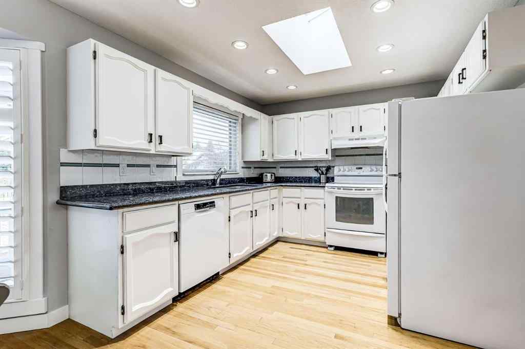 MLS® A2242388 - 31 Woodmont Way SW in Woodbine Calgary, Residential