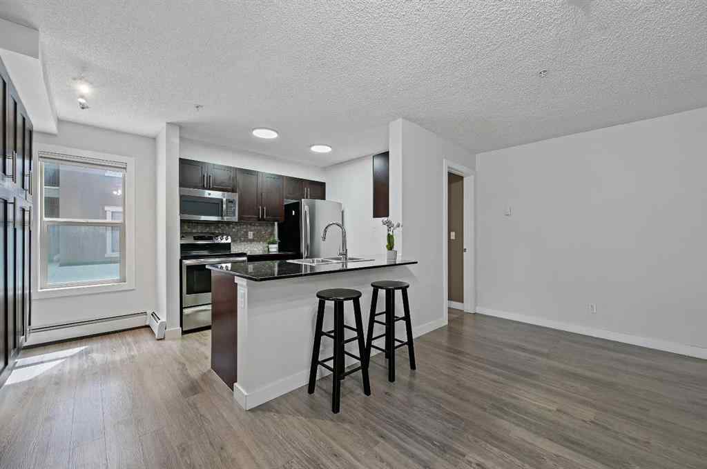 MLS® A2242399 - Unit #8113 403 Mackenzie Way SW in Downtown Airdrie, Residential