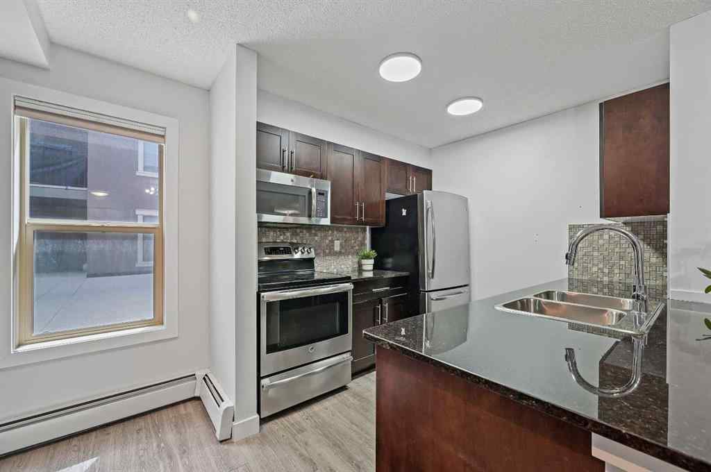 MLS® A2242399 - Unit #8113 403 Mackenzie Way SW in Downtown Airdrie, Residential