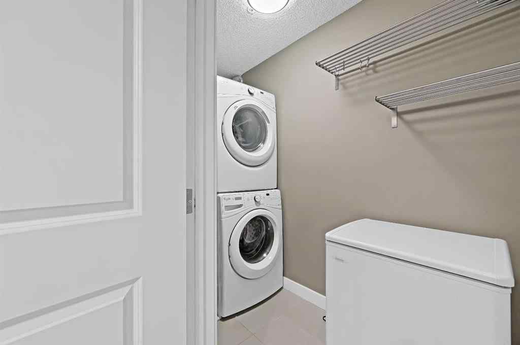 MLS® A2242399 - Unit #8113 403 Mackenzie Way SW in Downtown Airdrie, Residential