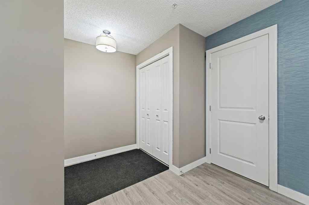 MLS® A2242399 - Unit #8113 403 Mackenzie Way SW in Downtown Airdrie, Residential
