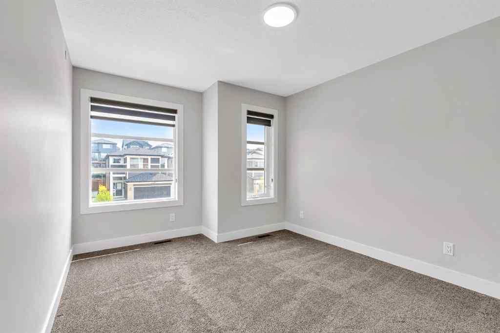 MLS® A2242476 - 311 Lucas Way NW in Livingston Calgary, Residential