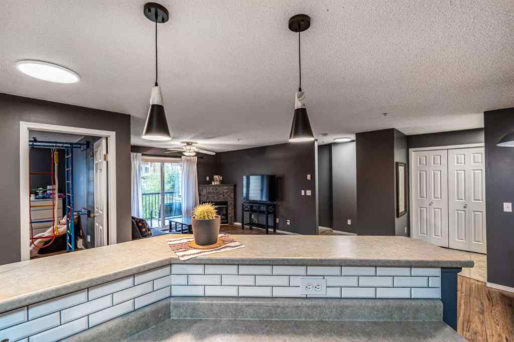MLS® A2242672 - Unit #8213 304 Mackenzie Way SW in Downtown Airdrie, Residential