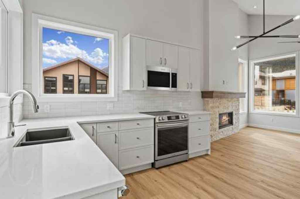MLS® A2242749 - Unit #203J 209 Stewart Creek Rise  in Three Sisters Canmore, Residential