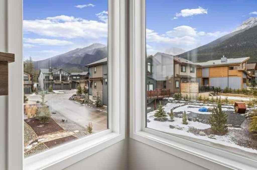 MLS® A2242749 - Unit #203J 209 Stewart Creek Rise  in Three Sisters Canmore, Residential
