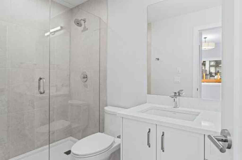 MLS® A2242749 - Unit #203J 209 Stewart Creek Rise  in Three Sisters Canmore, Residential