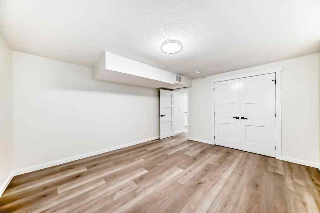 MLS® A2243109 - 64 Woodstock Road SW in Woodlands Calgary, Residential