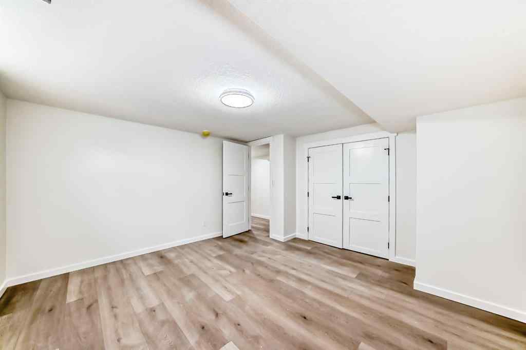 MLS® A2243109 - 64 Woodstock Road SW in Woodlands Calgary, Residential
